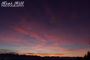 Sunrise and Crescent Moon over Evergreen Montana